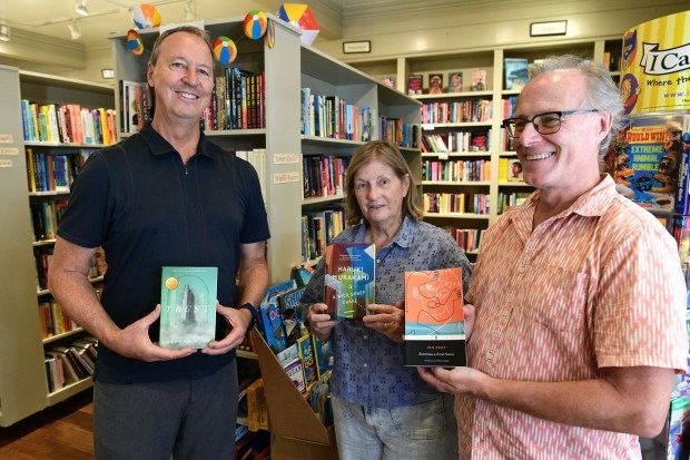 Richard Turner, left, the new owner of Diesel, A Bookstore in Santa Monica, and the previous owners, Allison Reid and John Evans, on Aug. 12, 2024. (SCNG)