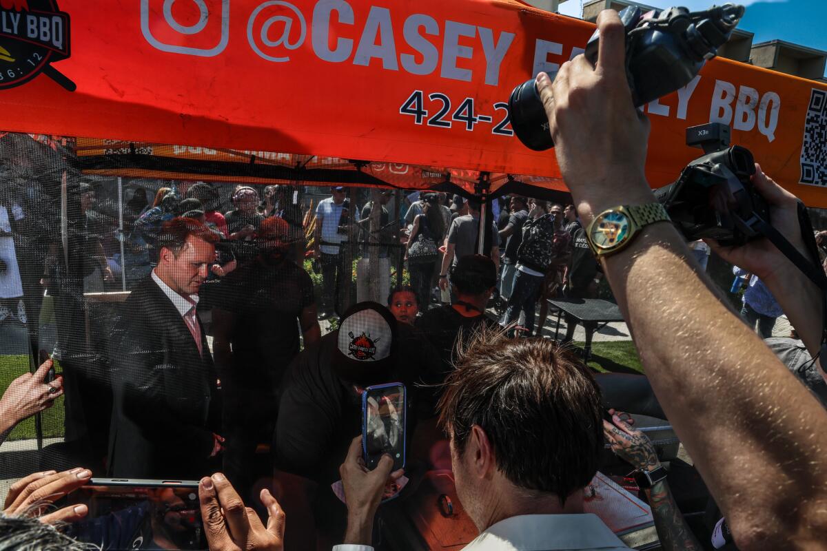 At one point, Pratt posed in front of a barbecue trailer, pledging that "we're gonna have lots of grilling in L.A."