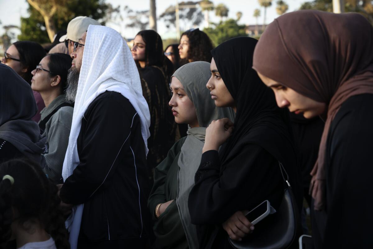 Worshipers attend an interfaith vigil near the Islamic Center of San Diego
