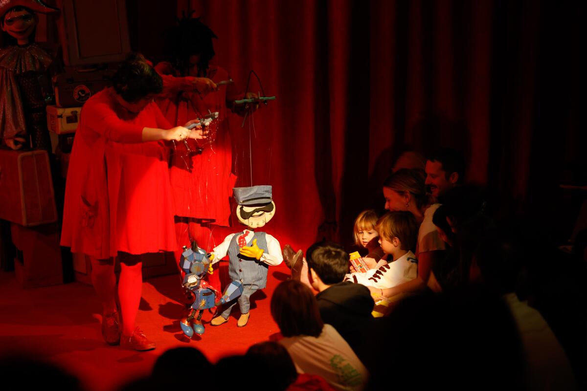 Marionettes twirl on stage at the premiere of 'Choo Choo Revue' at the Bob Baker Marionette Theatre 
