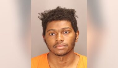 Man charged after woman shot, carjacked outside Oakland County business