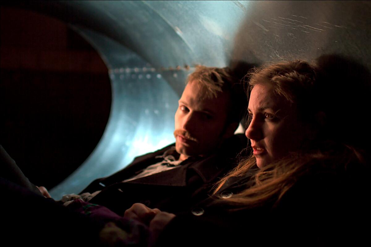 David Call and Lena Dunham sit together.