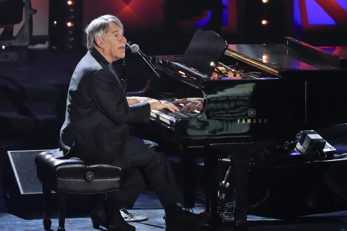Stephen Schwartz sings and plays piano onstage.
