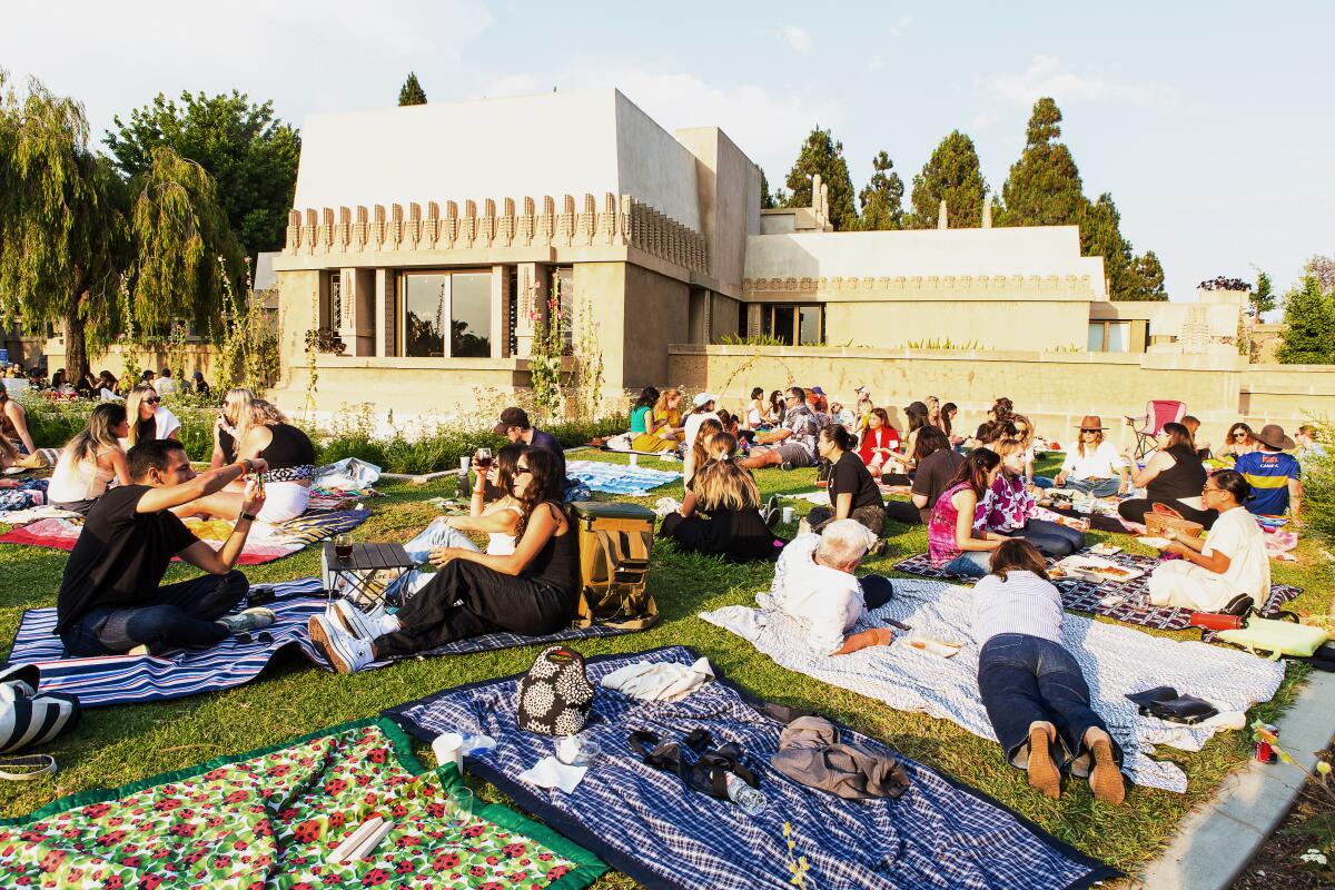 Guests sit on blankets at Barnsdall Art Park.