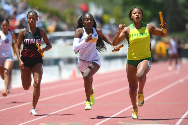 Long Beach Wilson's Kayla Brown and Long Beach Poly's Brooklyn Lee compete in the Division 1 4x100-meter relay at the CIF Southern Section Track and Field Finals at Moorpark High School on Saturday, May 16, 2026.(Photo by Andy Holzman, Contributing Photographer)