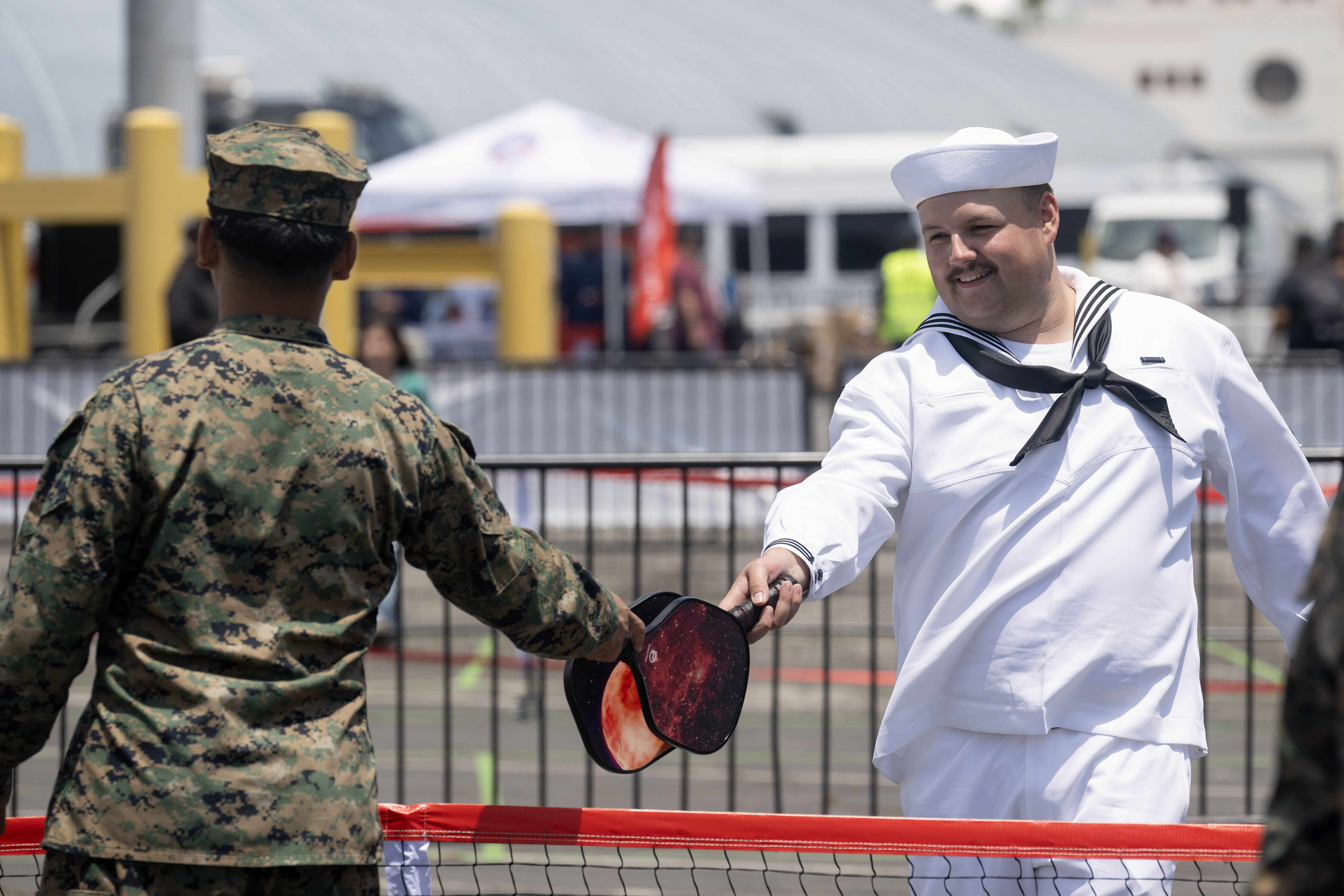 Mass Communication Specialist Seaman Apprentice Samuel Blade Park, right, plays...