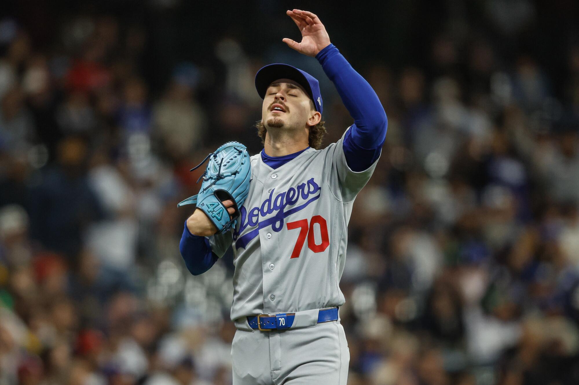 Dodgers pitcher Justin Wrobleski reacts after giving up runs during the first inning against the Brewers Friday.