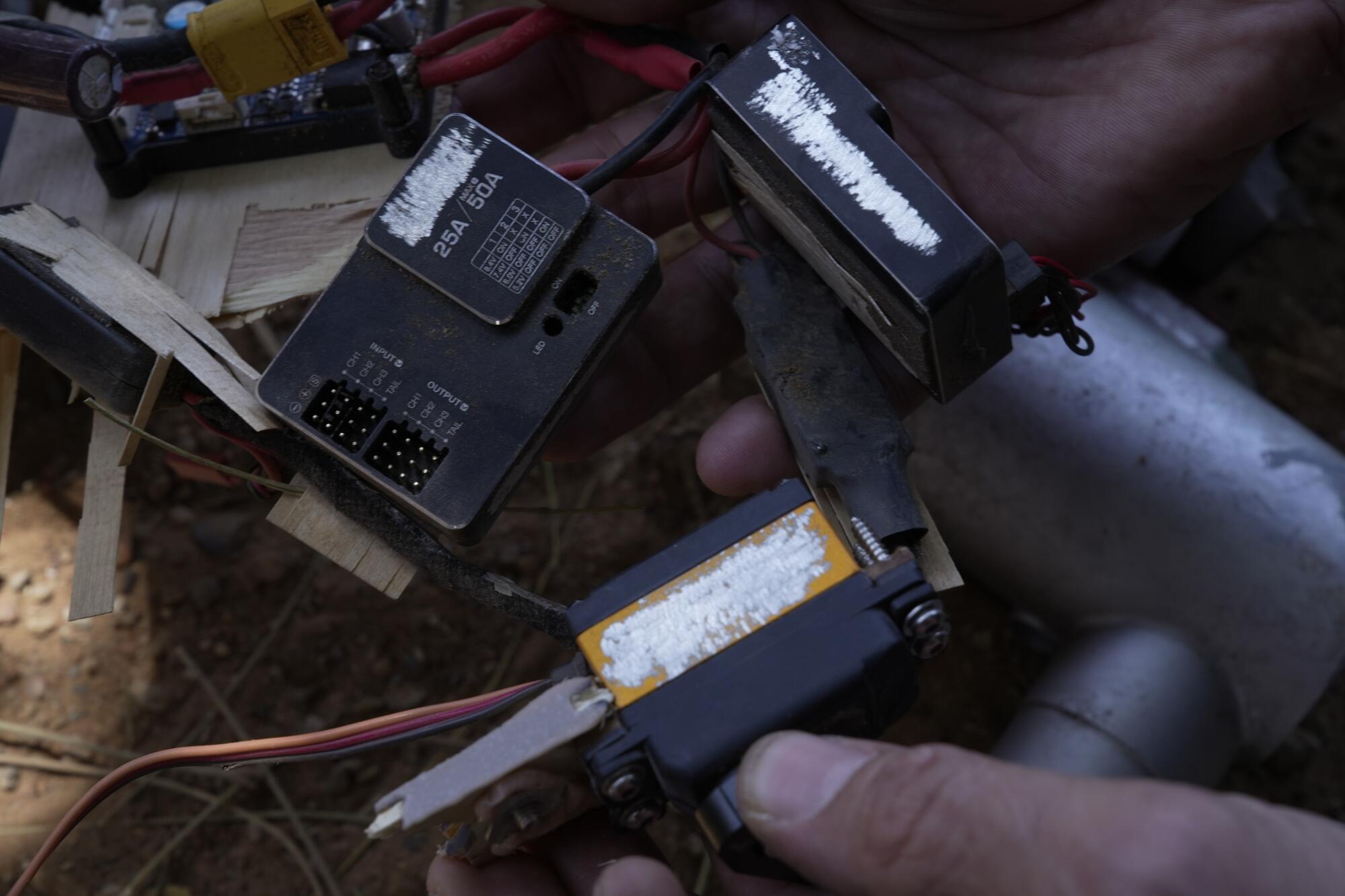 Components from a drone, with serial numbers and other markings filed off