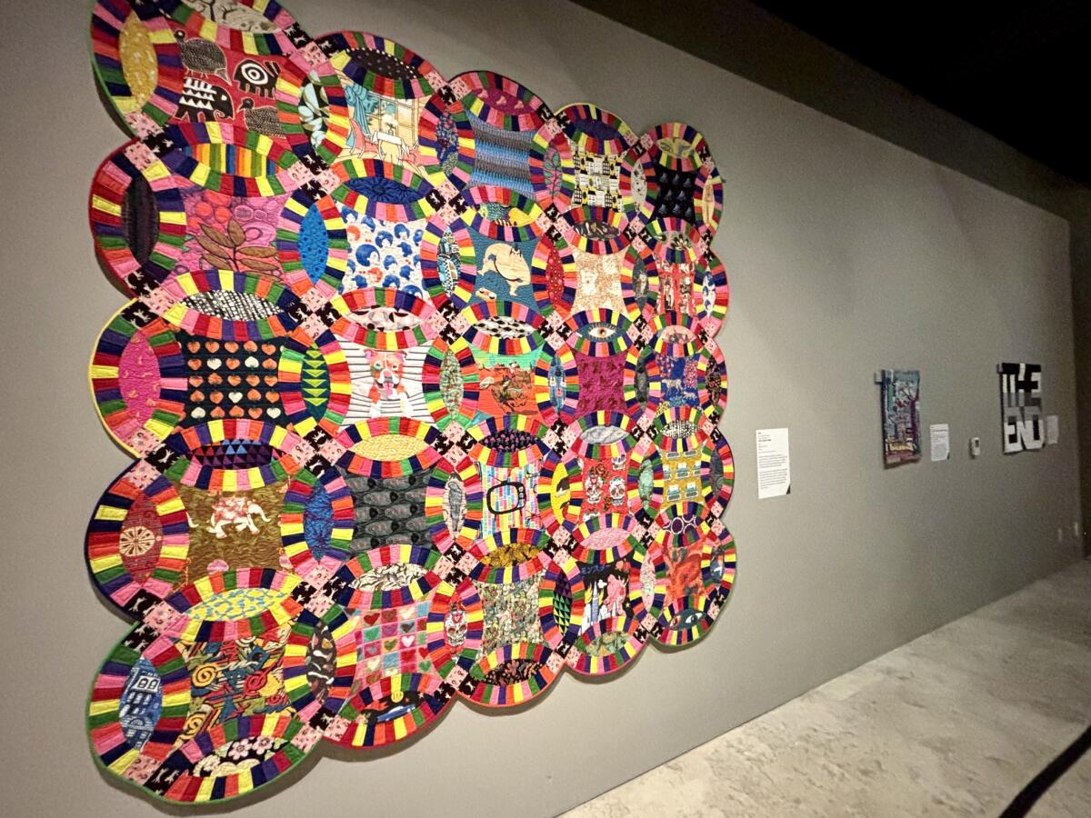 A modern quilt from 2022 is a reinterpretation of a Double Wedding Ring quilt, a traditional quilting technique.