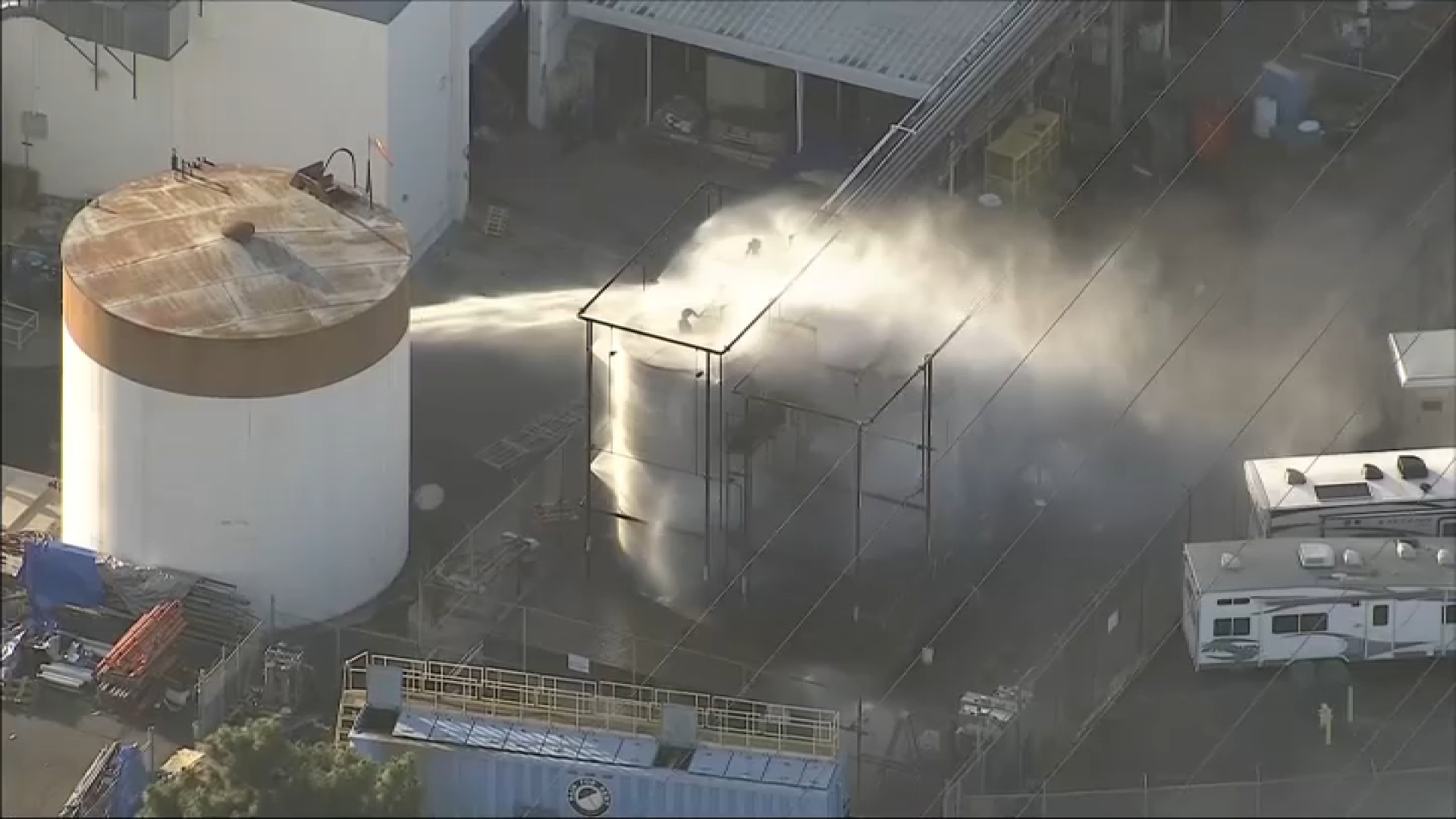 Water is spayed on a overheating chemcail tank in Garden Grove.