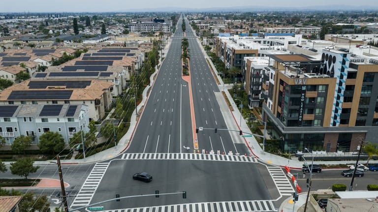 The streets remain empty in Garden Grove, Calif., on Sunday,...