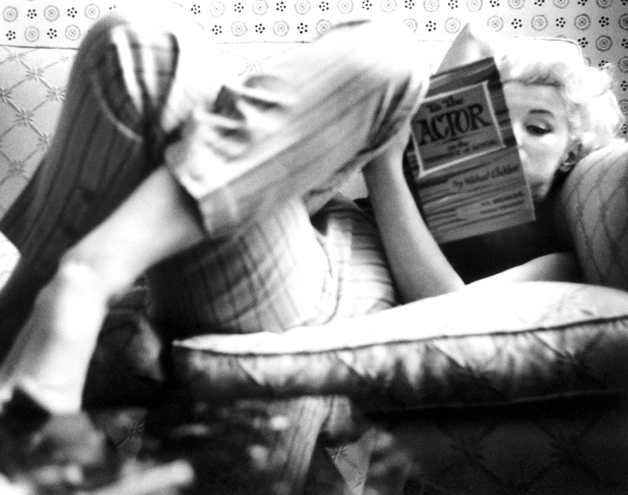 Actress Marilyn Monroe reads the book "To the Actor: On the Technique of Acting" by Michael Chekhov