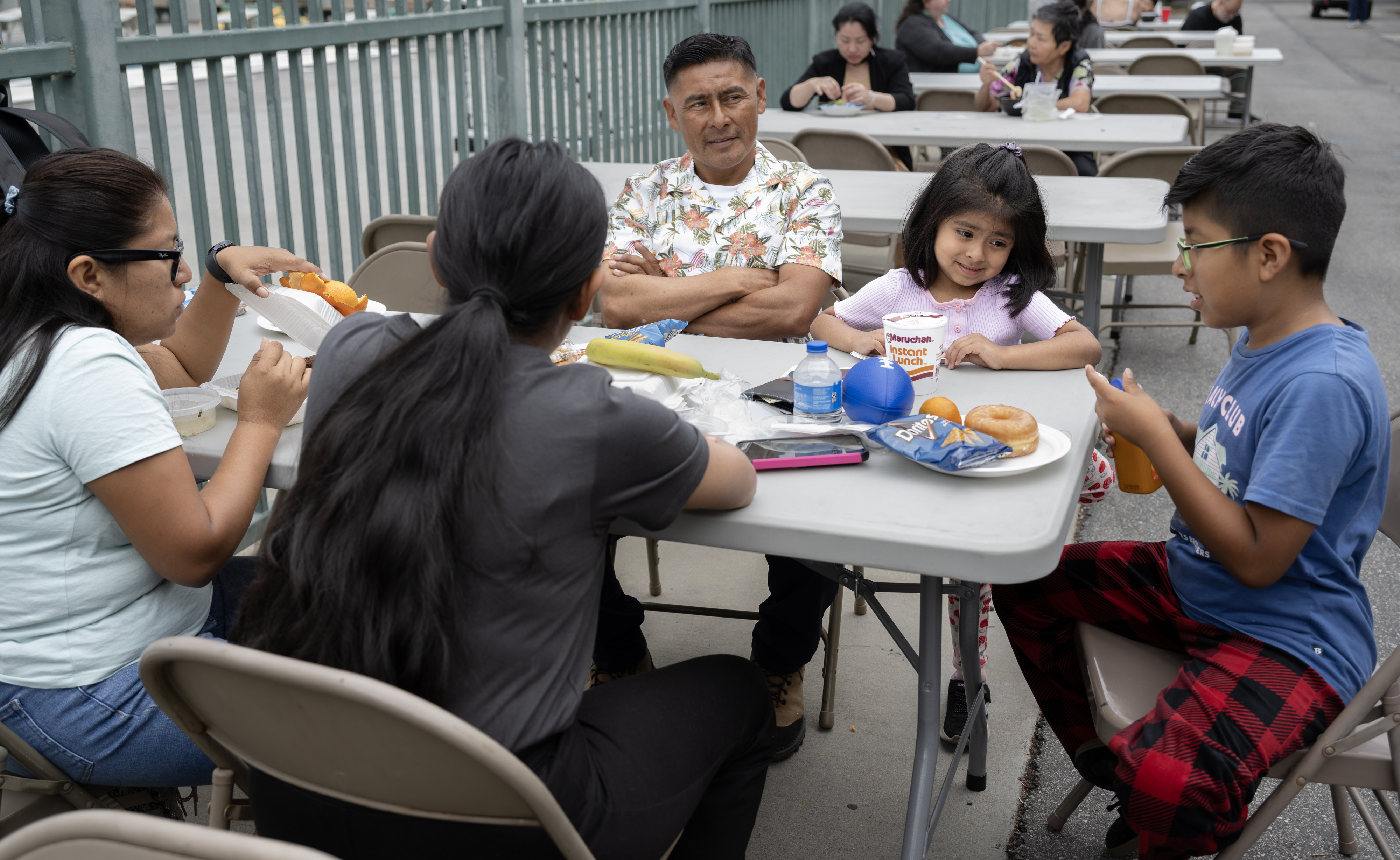 Jesus and Viridiana Arcos, left, and center, and their children...