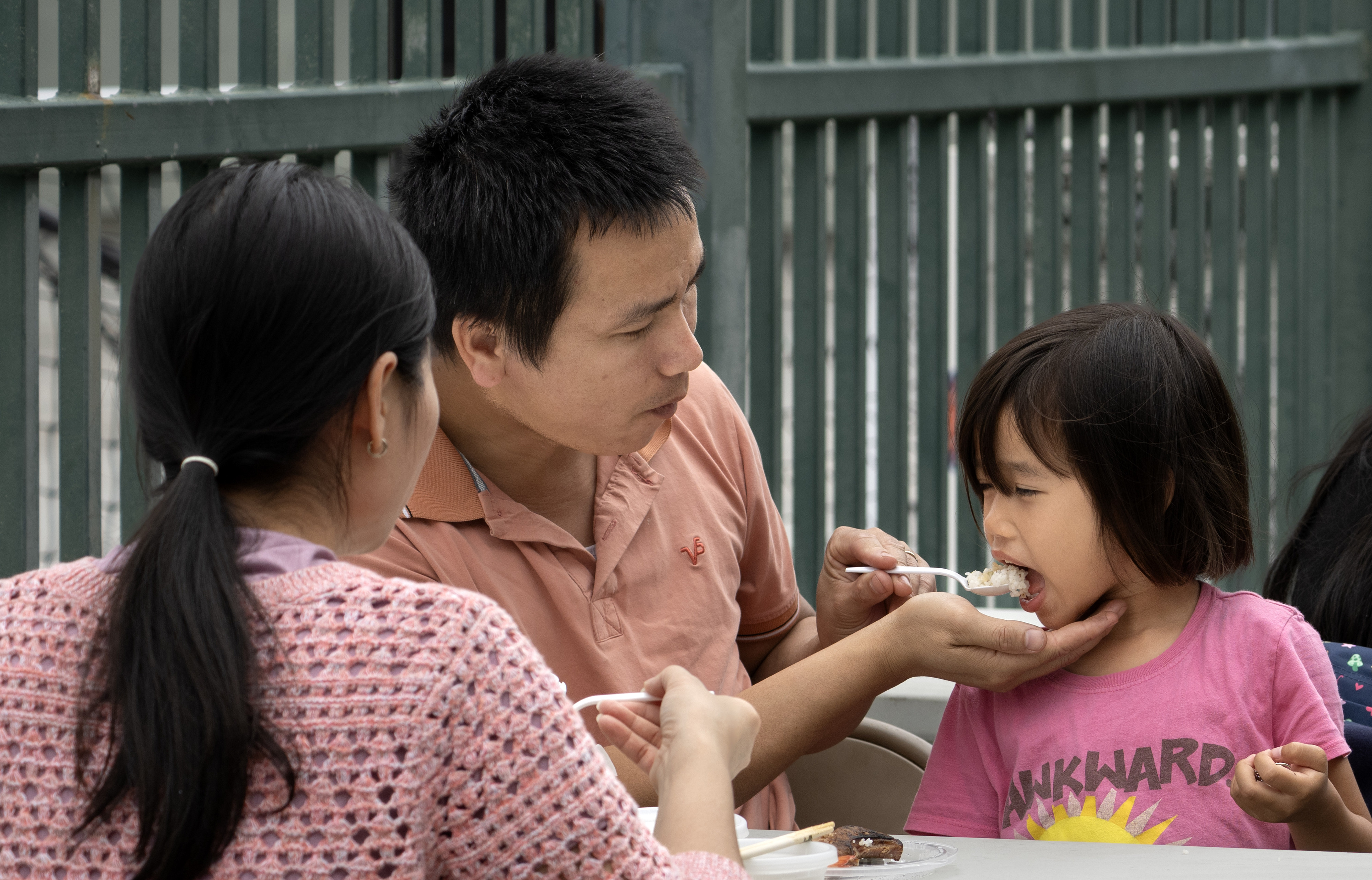 Quoc Ngo feeds his 4-year-old daughter, Annie, at Golden West...