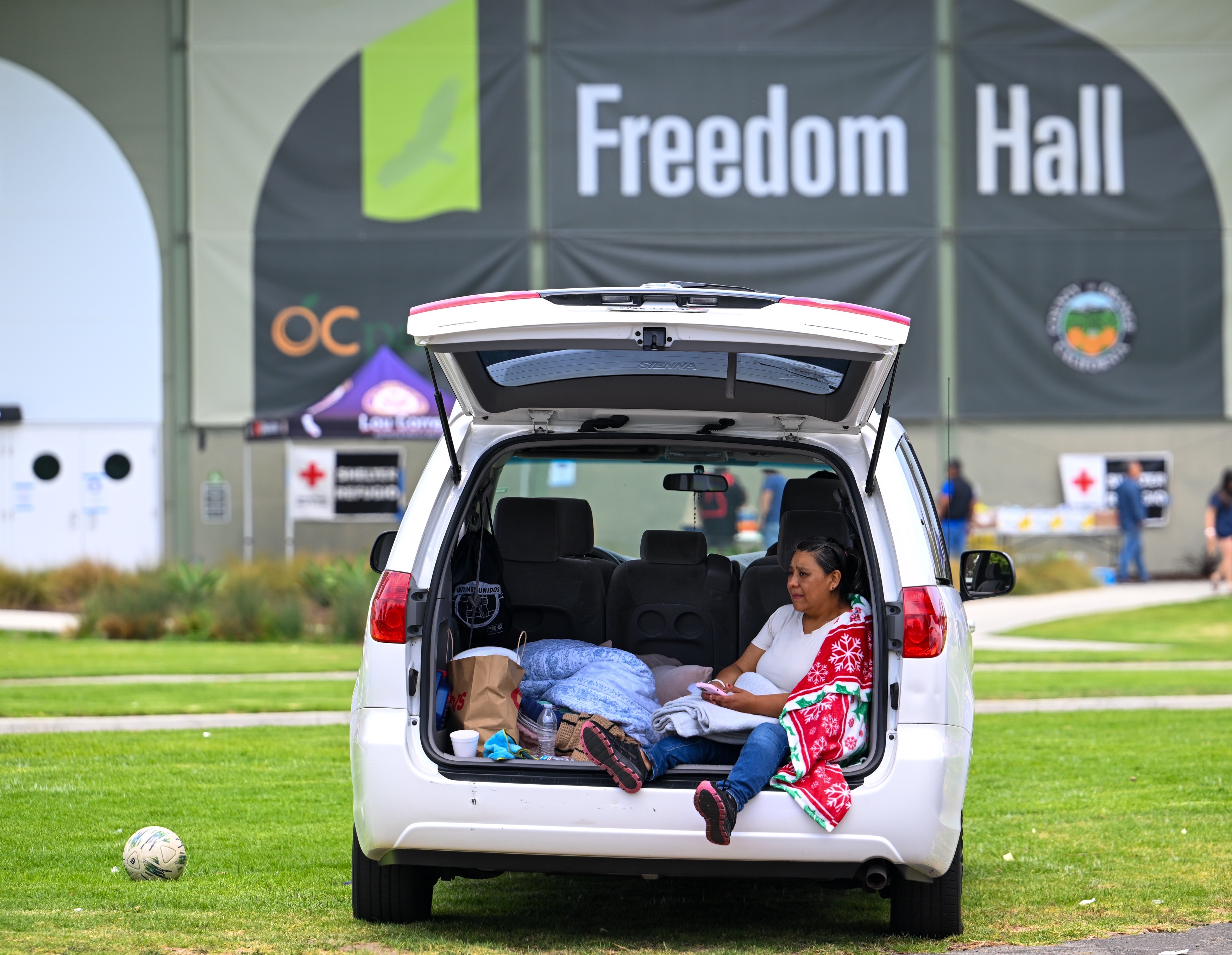 Elizabeth Pichardo hangs out in her car outside the Freedom...