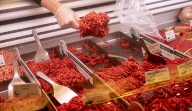 An employee prepares an order of ground beef for a customer at an Oakland butcher shop in 2020. Ground beef prices are up nearly 19% compared to this time last year.