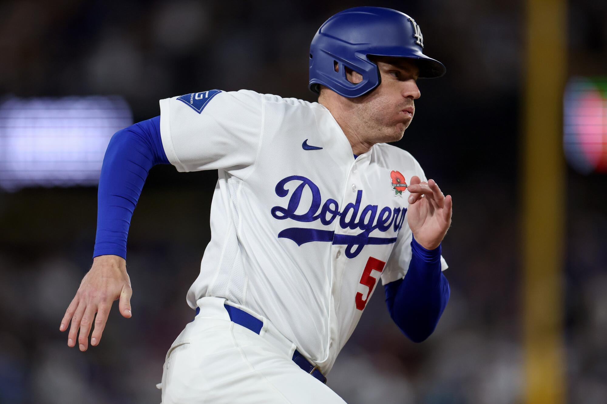 Dodgers first baseman Freddie Freeman rounds third base on his way home during the seventh inning of Monday's game.