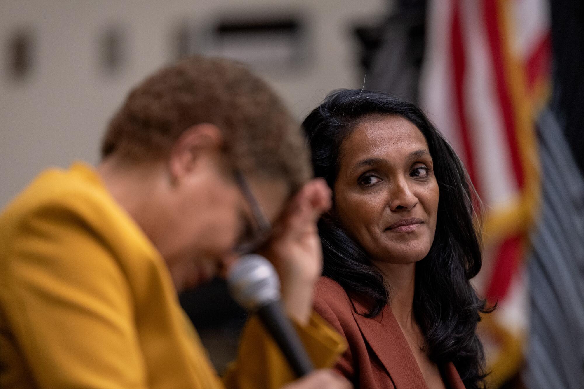 Los Angeles Mayor Karen Bass and Los Angeles Councilwoman Nithya Raman, right, take part in a candidates forum.