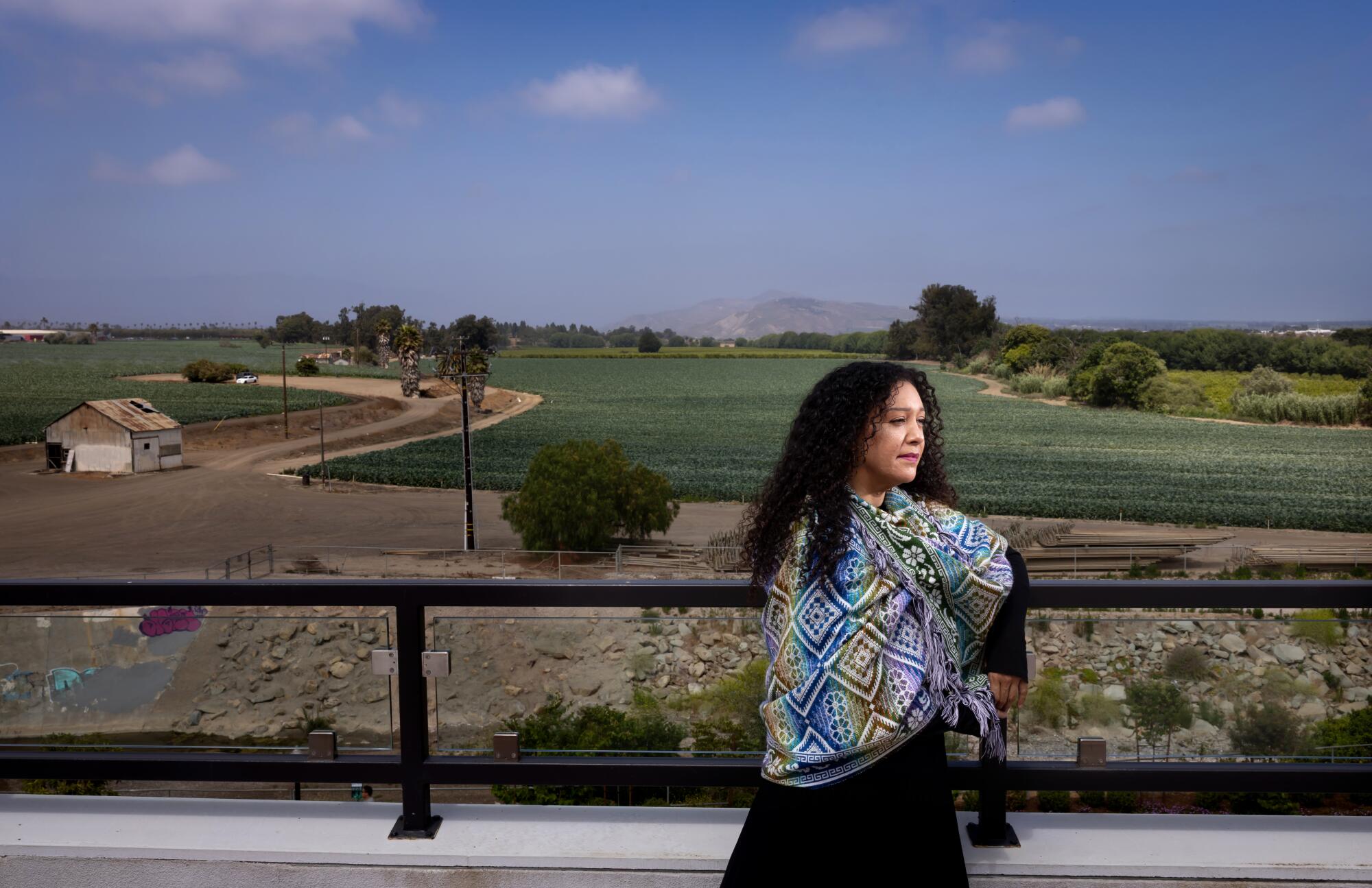 Vanessa Valdez leans on a railing.