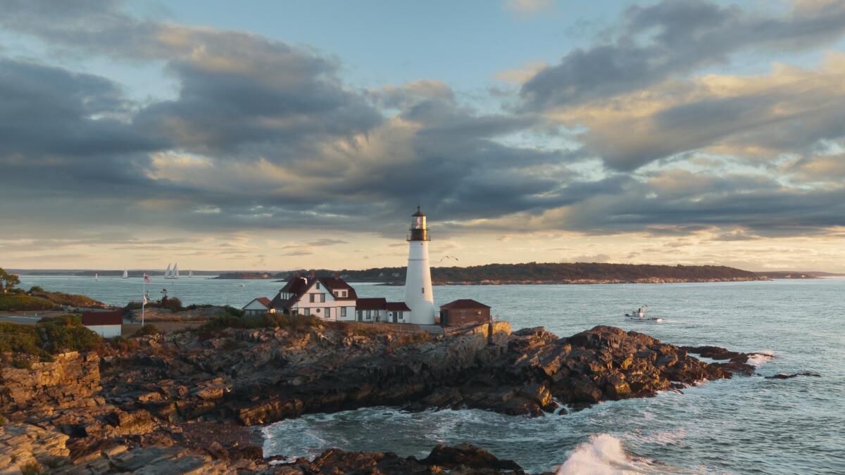 A Maine lighthouse as scene from the air. 