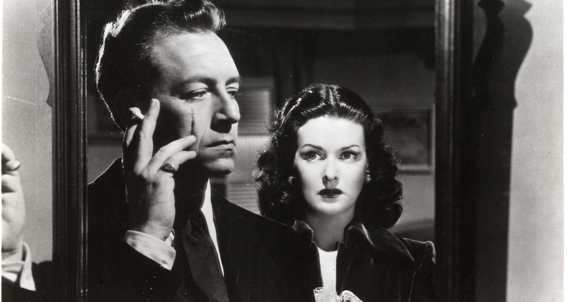 Paul Henreid and Joan Bennett in the 1948 film noir "Hollow Triumph," which features cinematography by John Alton.