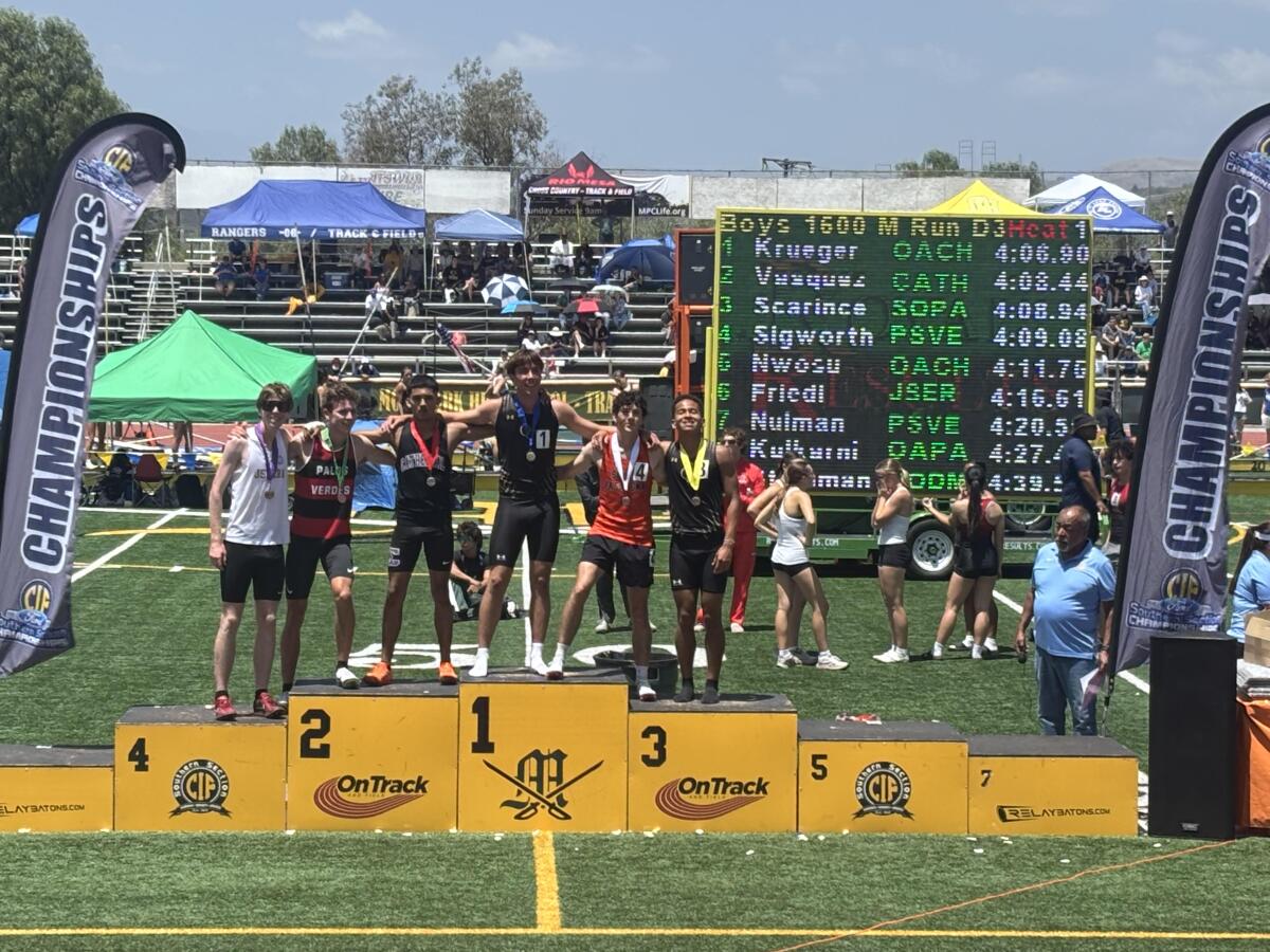 Jonah Jeovany Vasquez of Cathedral is on the podium after finishing second in the Division 3 1,600 at Moorpark.