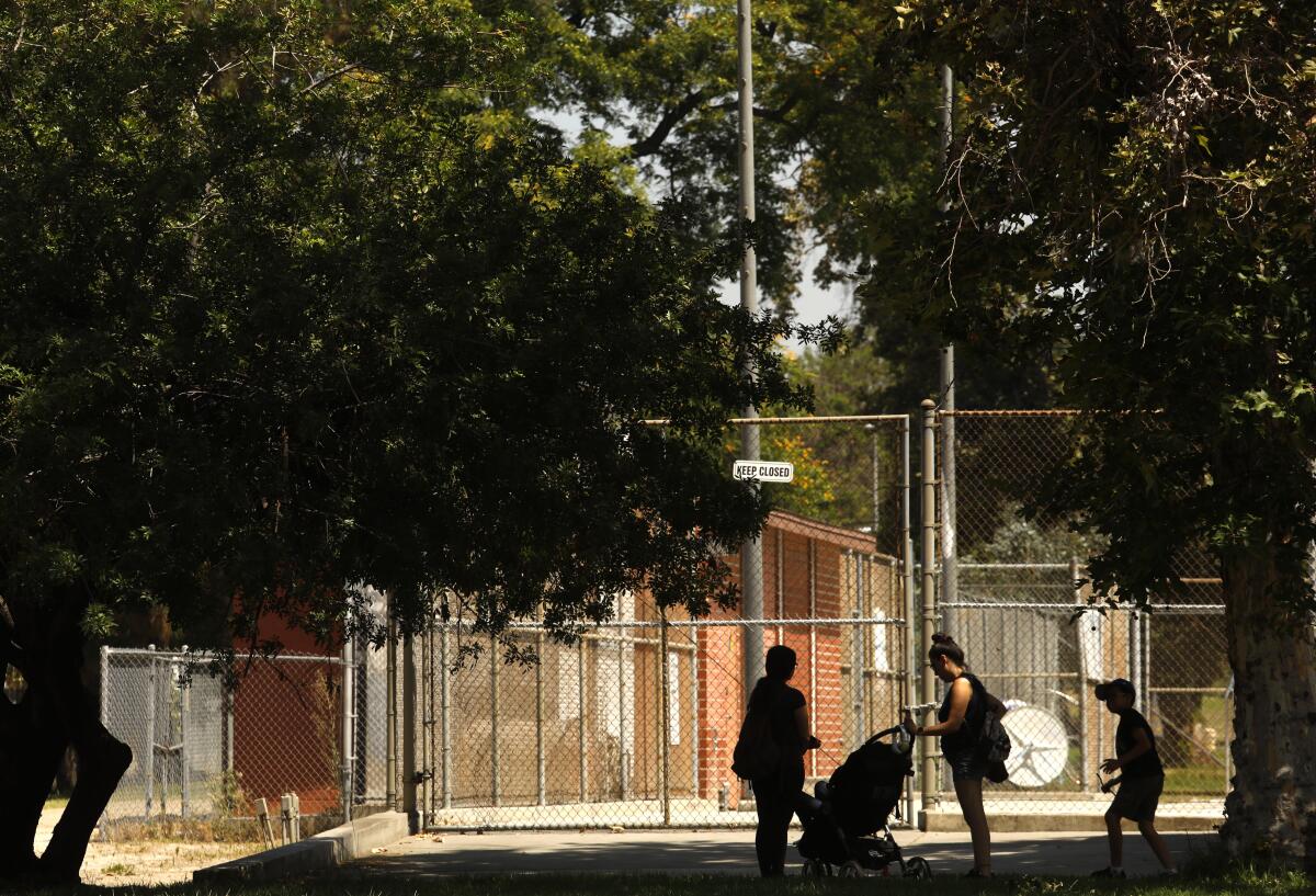 People visit Valley Plaza Park, nearby Whitsett Fields Park in North Hollywood.