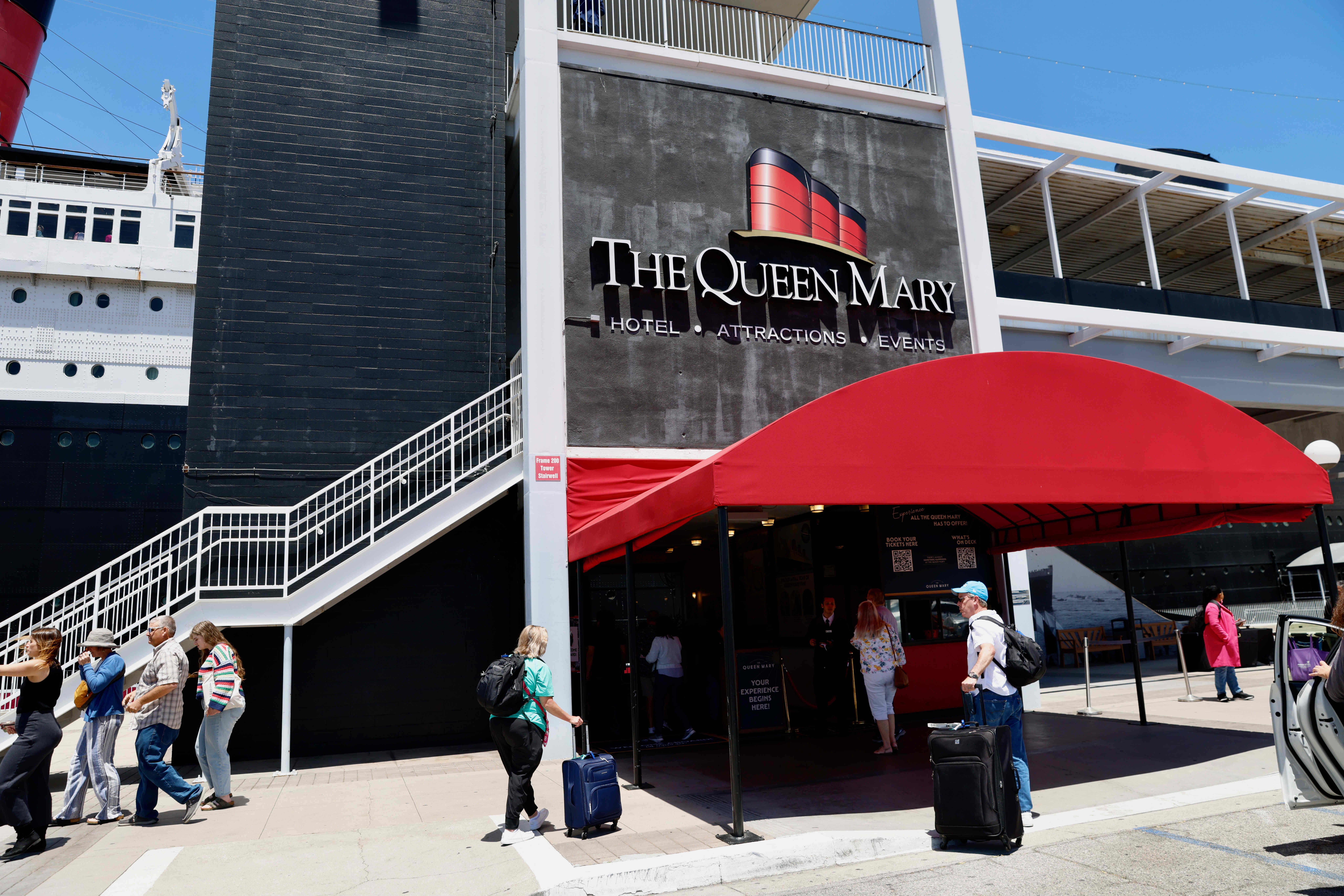 Hotel guests arrive at the Queen Mary in Long Beach...