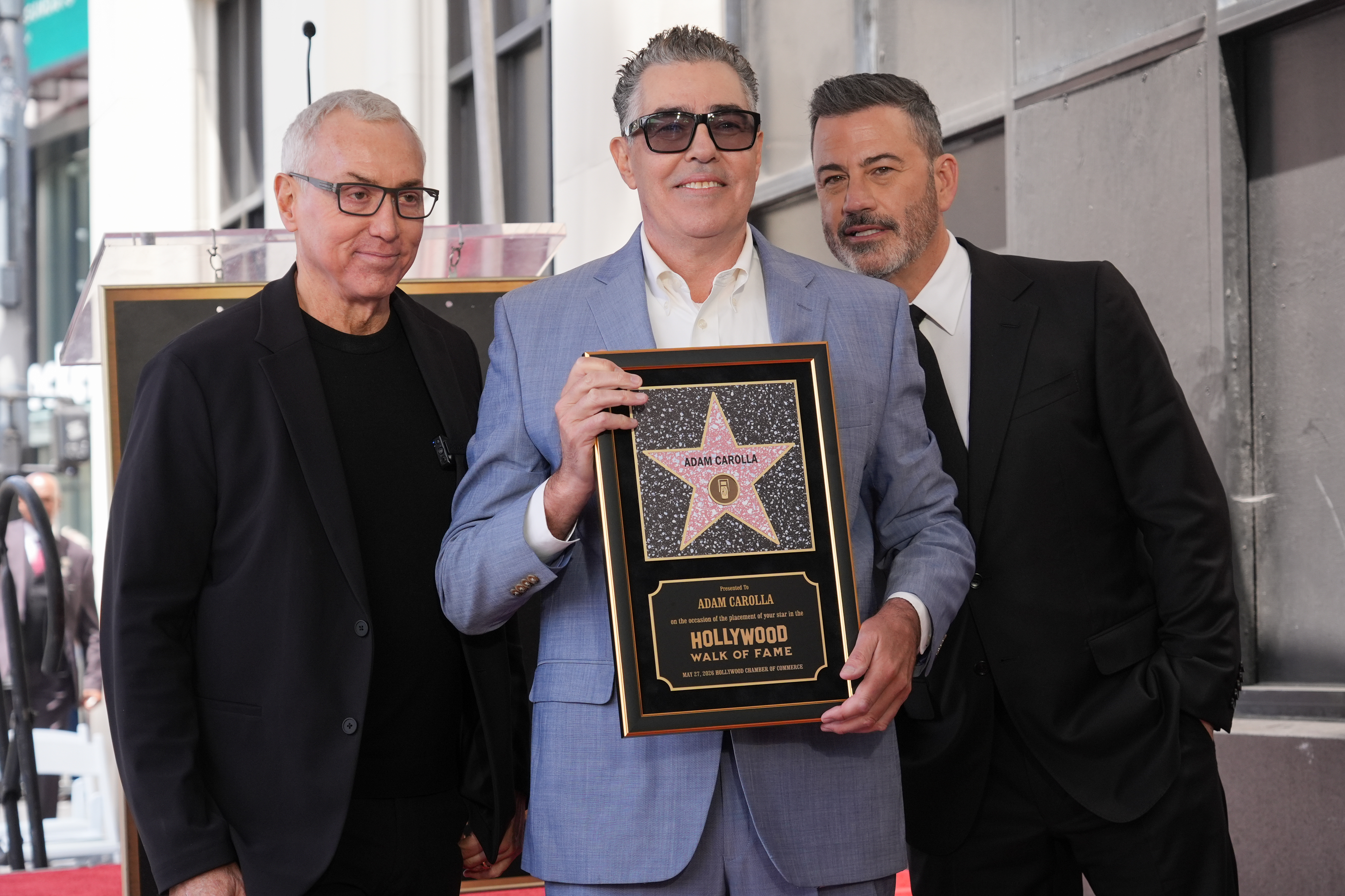 Drew Pinsky, from left, Adam Carolla, and Jimmy Kimmel pose...