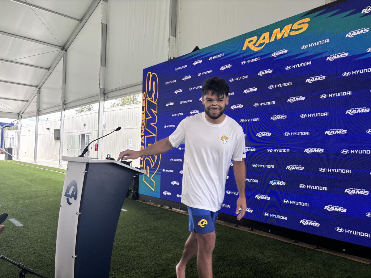 Rams wide receiver Puka Nacua smiles after speaking to reporters at Rams OTAs at the training facility.