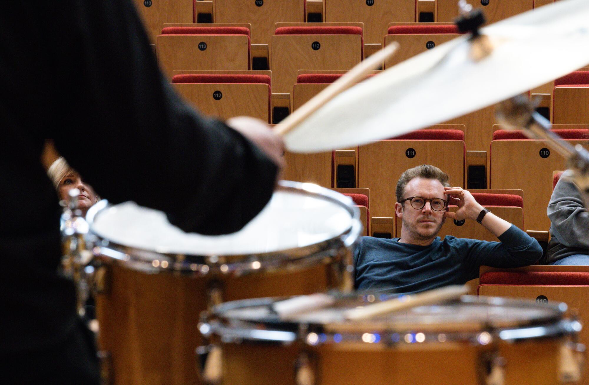 Daniel Harding listens to students perform at the Judith and Thomas L. Beckmen YOLA Center.
