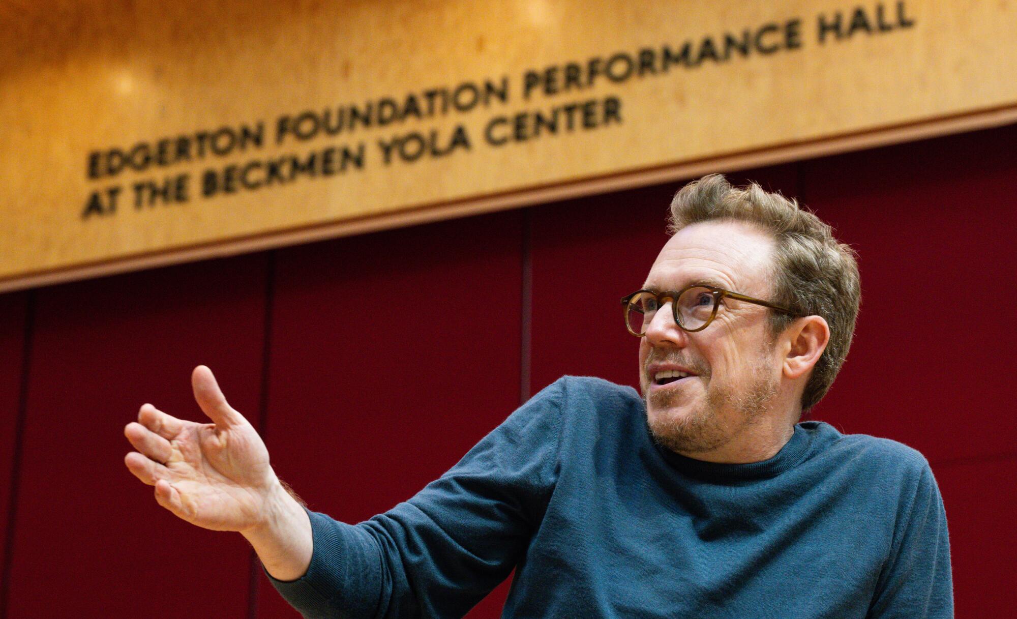 Daniel Harding is interviewed by a student at the Judith and Thomas L. Beckmen YOLA Center.