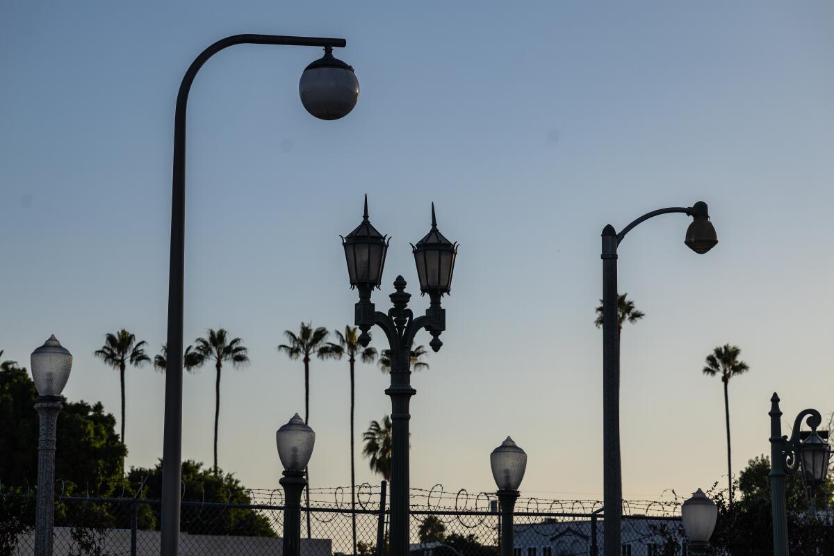 Dark streetlights.