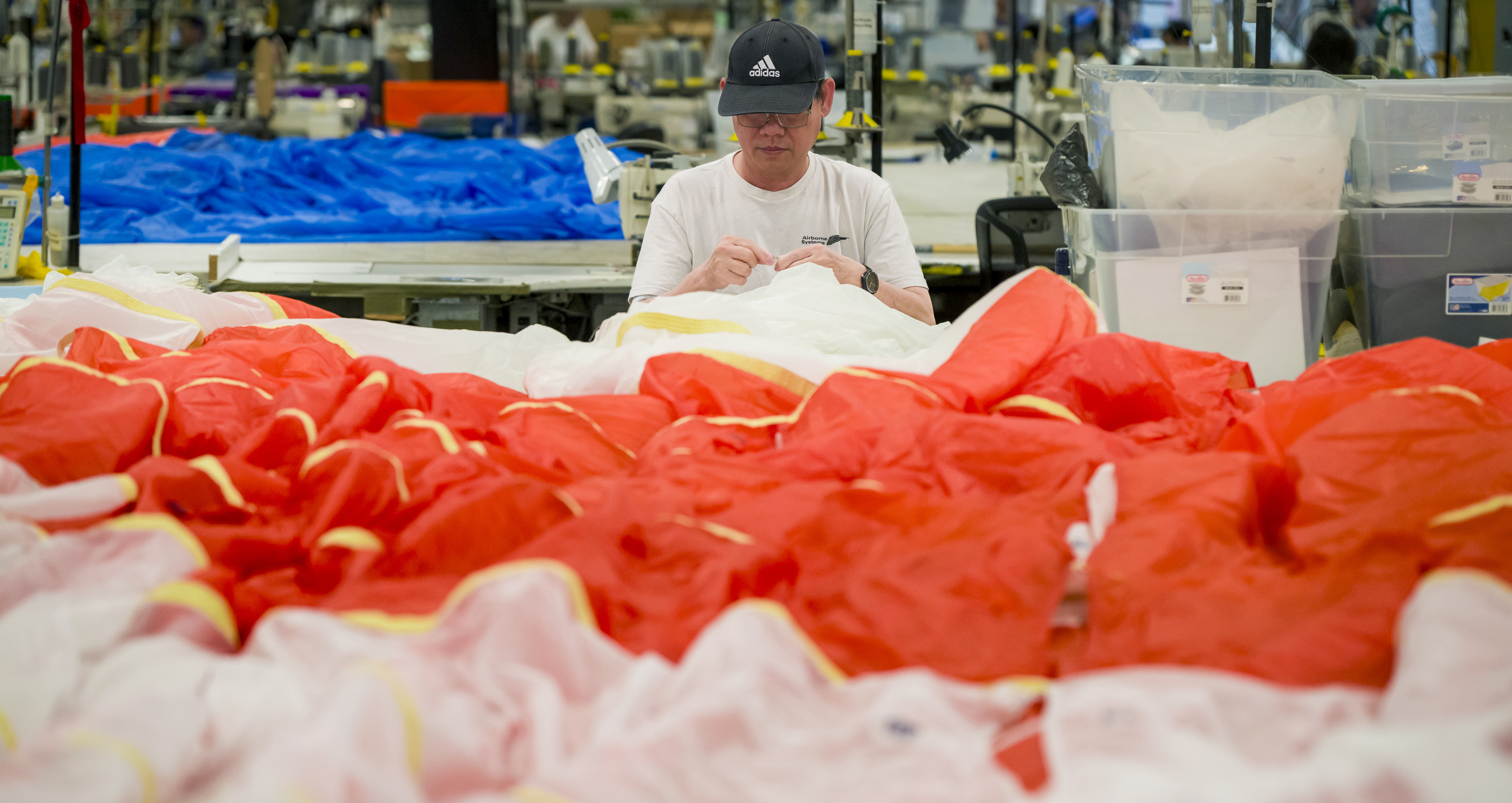 An employee works on one of the three canopies for...