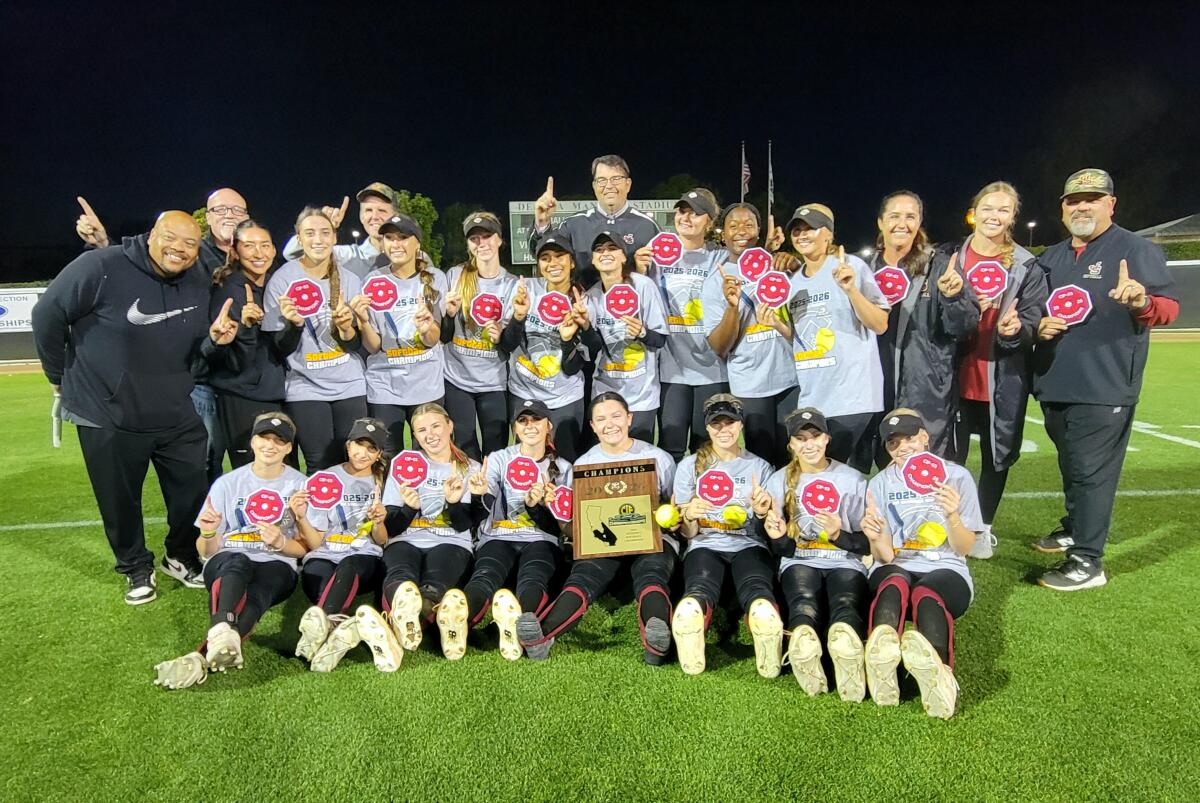 JSerra High players and coaches pose for a photo with the Southern Section Division 1 championship plaque.