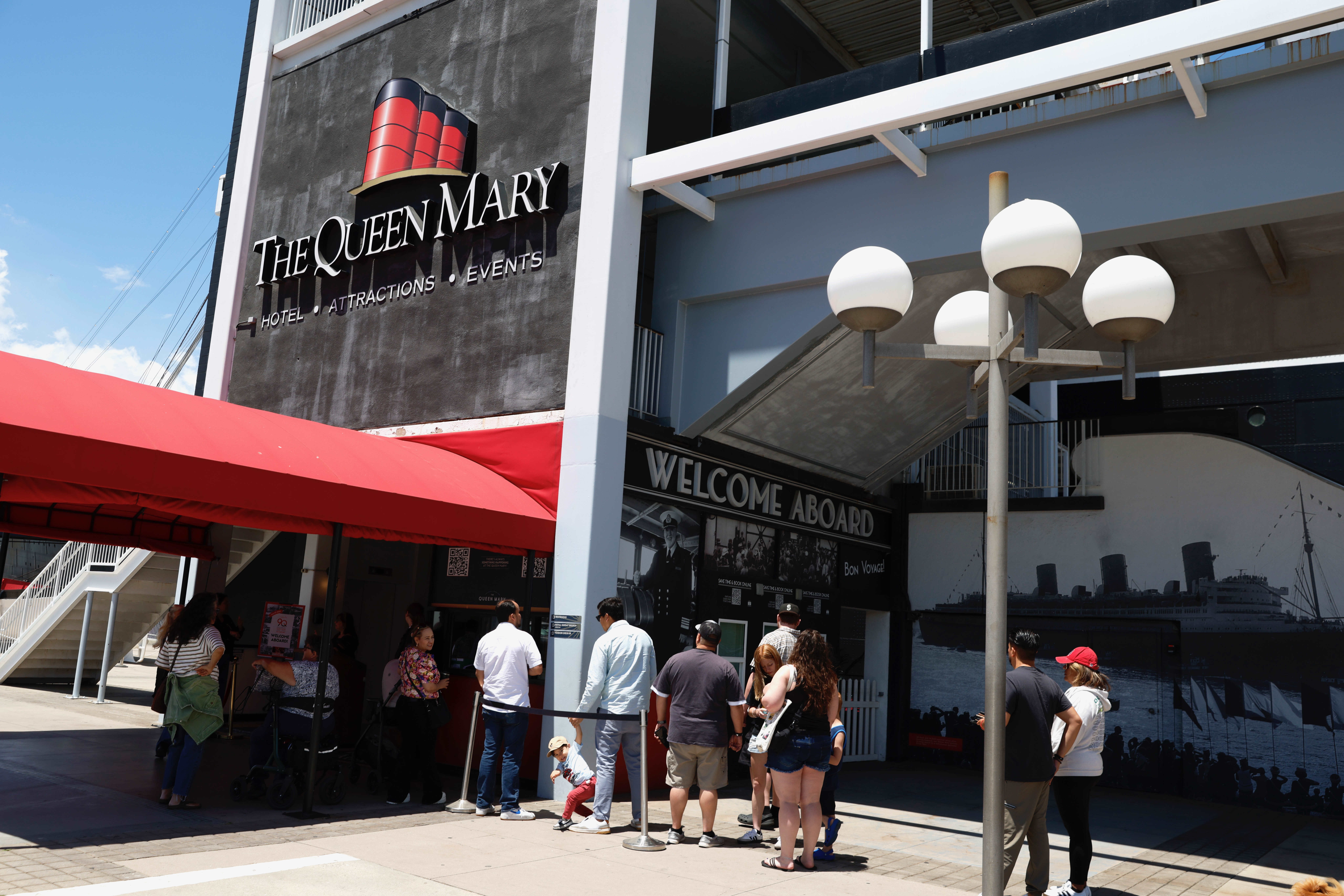 People visit the Queen Mary in Long Beach on Wednesday,...