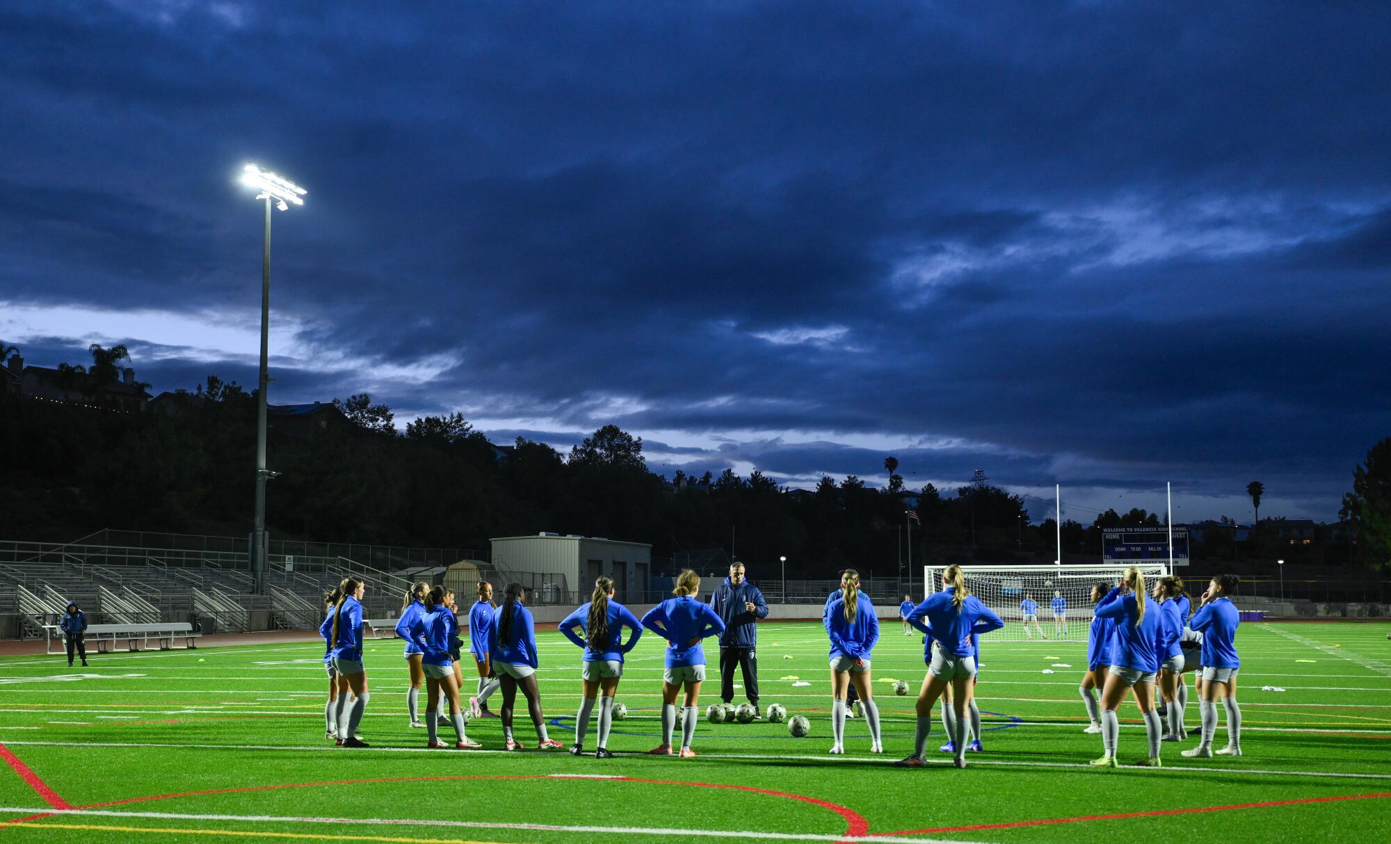The Santa Clarita Blue Heat head coach Leonardo Neveleff (center) talks to his team before a practice.