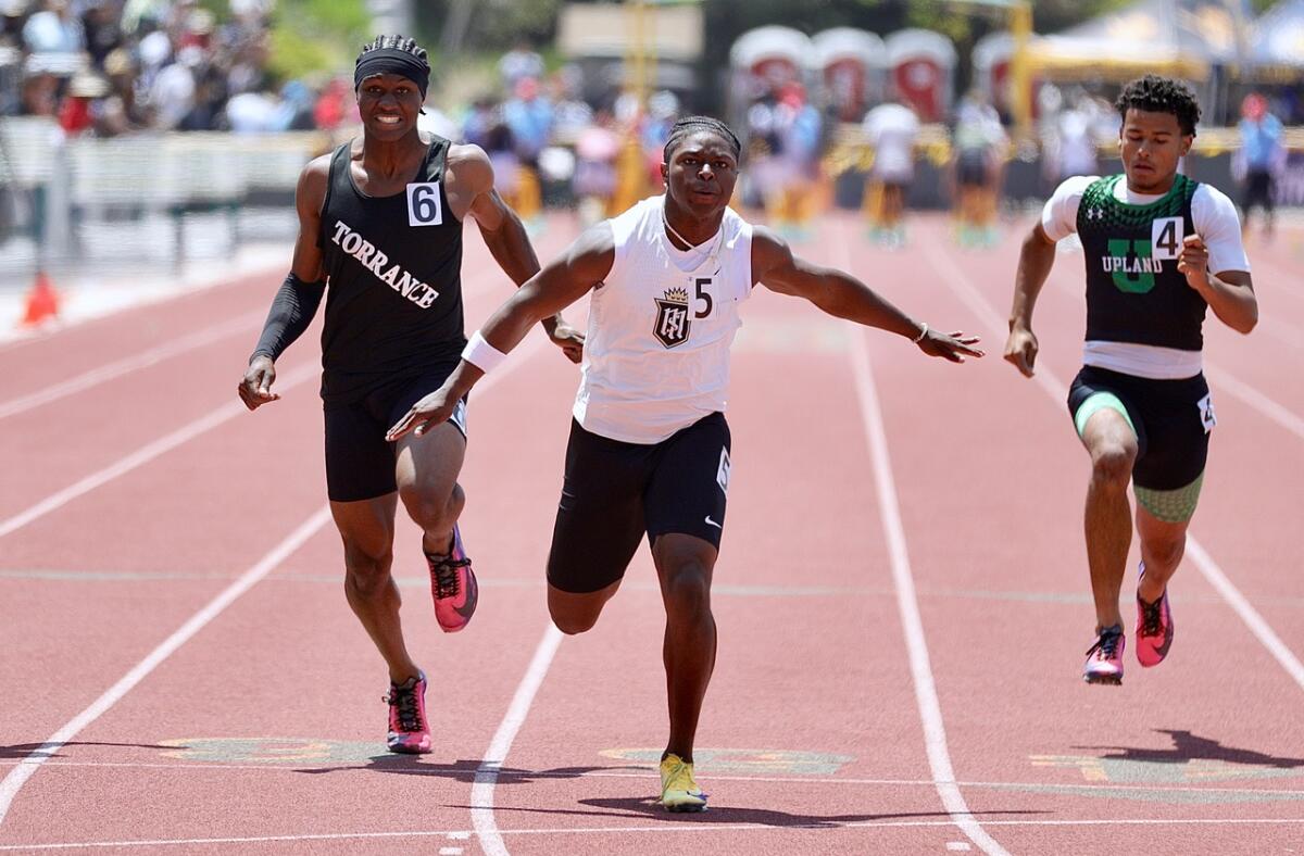 Servite’s Benjamin Harris wins the 100 meters in 10.17 seconds at the Masters Meet on May 23.