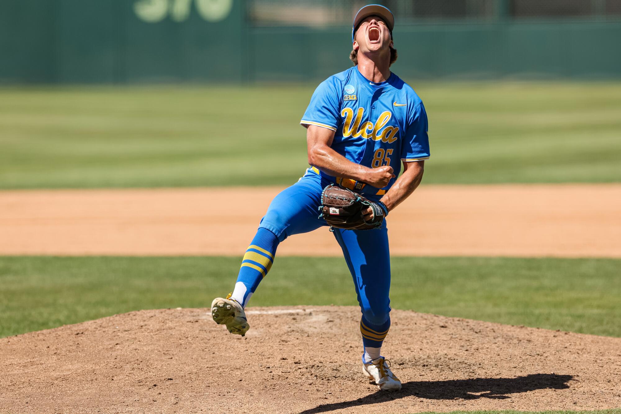 UCLA pitcher Cal Randall reacts after striking out a Virginia Tech batter.