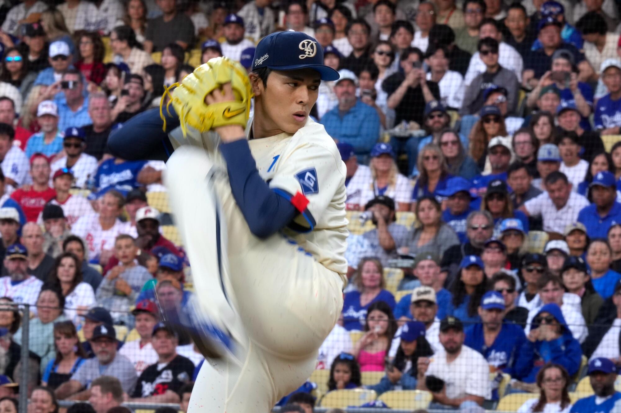 Dodgers starting pitcher Roki Sasaki delivers during the first inning Saturday against the Phillies.