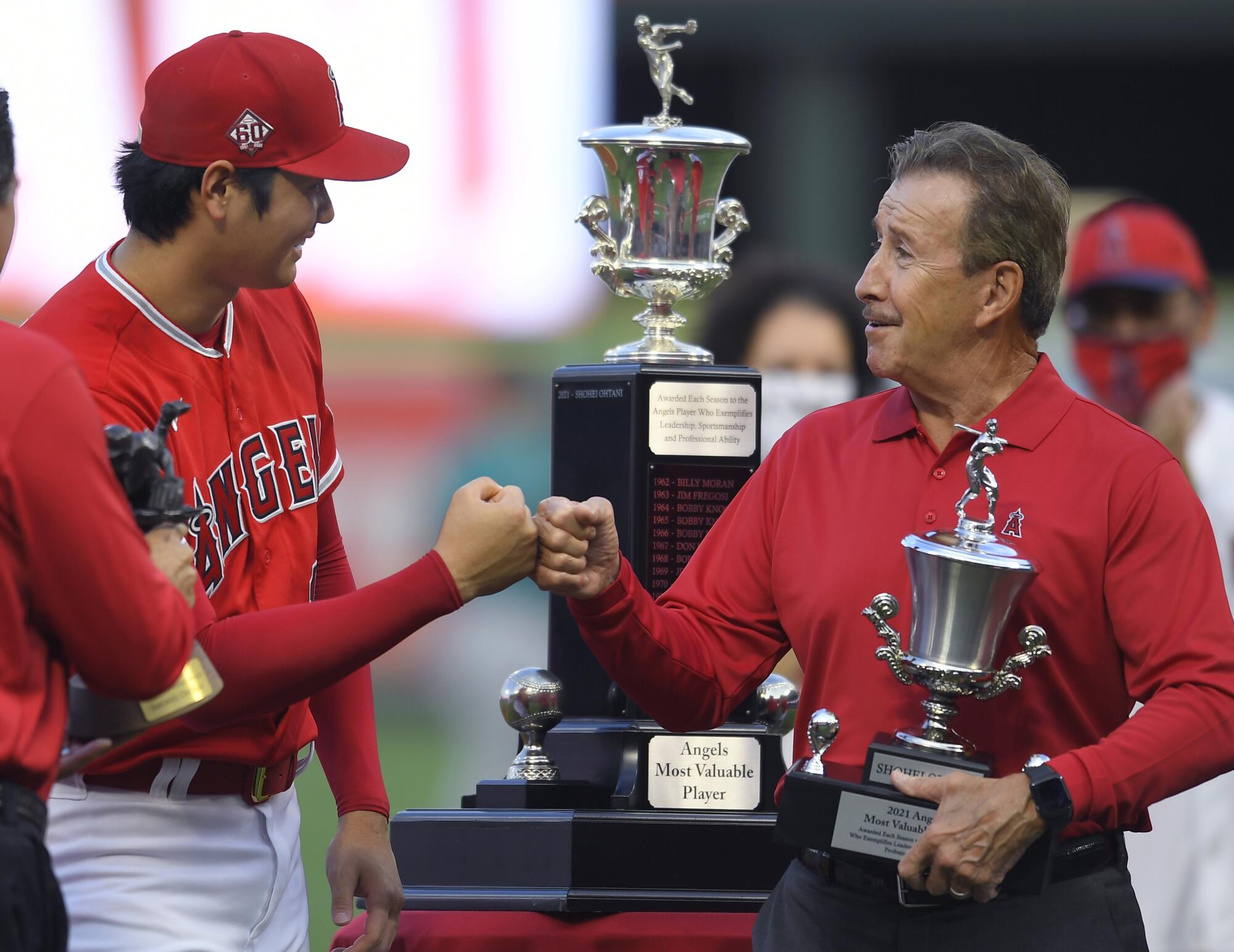 Shohei Ohtani bumps fists with Angels owner Arte Moreno