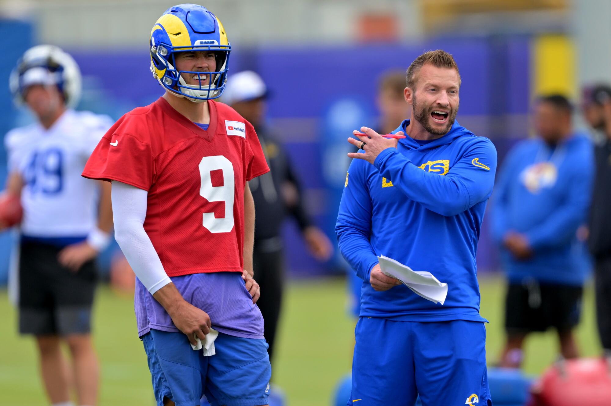 Rams quarterback Matthew Stafford and coach Sean McVay talk during practice on Thursday.