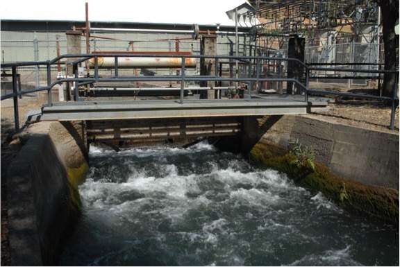 Water drawn from the Eel River spills from a tailrace...