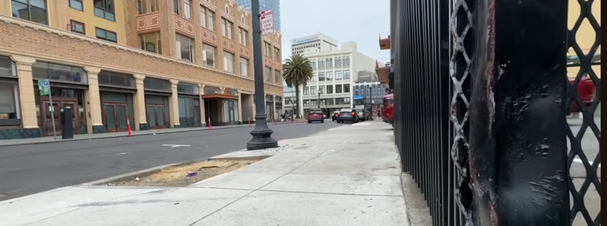 downtown oakland injured car runs over side walk