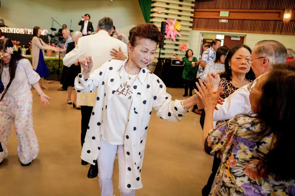 Tina Long dances at the Senior Prom at the County Fair Building at Golden Gate Park in San Francisco on Wednesday. (Brontë Wittpenn/S.F. Chronicle)