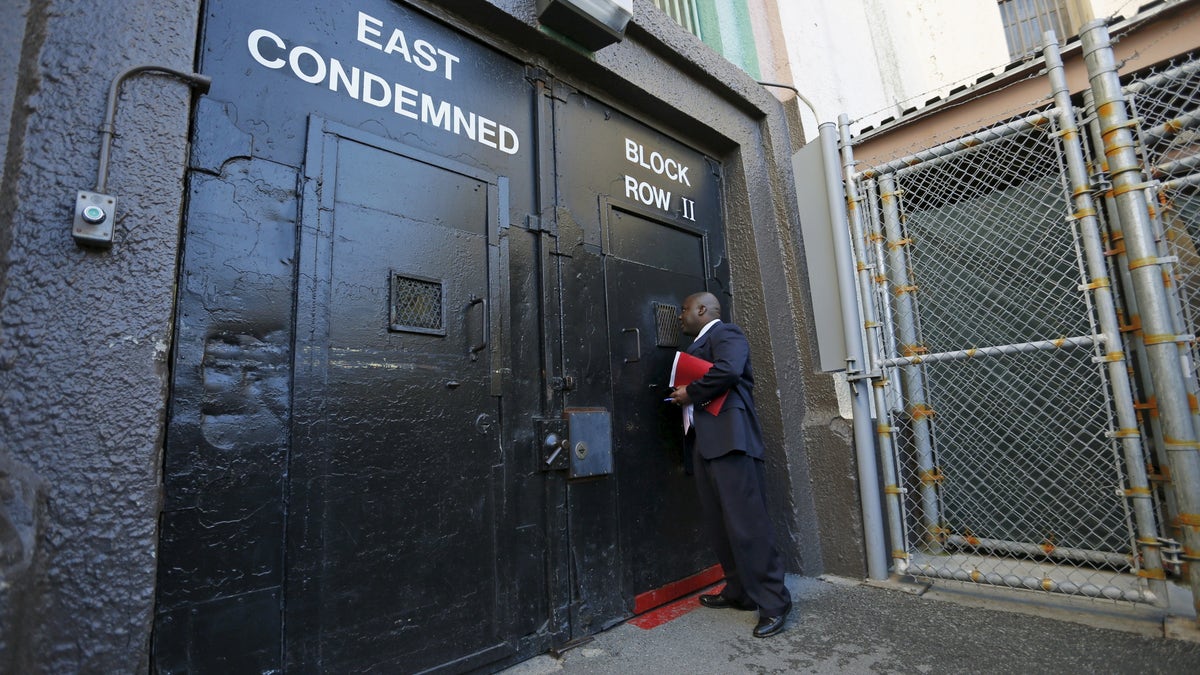 Lieutenant Sam Robinson knocking on a door at San Quentin State Prison death row