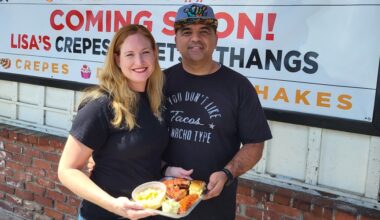 a couple holding a bbq plate