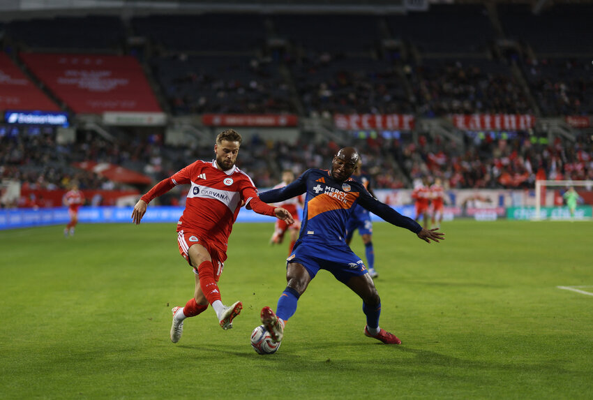 Chicago Fire FC midfielder Philip Zinckernagel (11) and FC Cincinnati forward Bryan Ramirez (29) battle for control of the ball during the first half at Soldier Field.