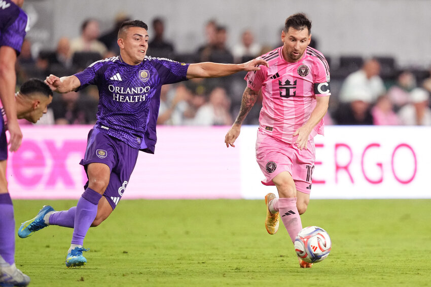 Orlando City SC midfielder Braian Ojeda (8) battles for possession with Inter Miami CF midfielder Lionel Messi (10) during the second half at Miami Freedom Park.