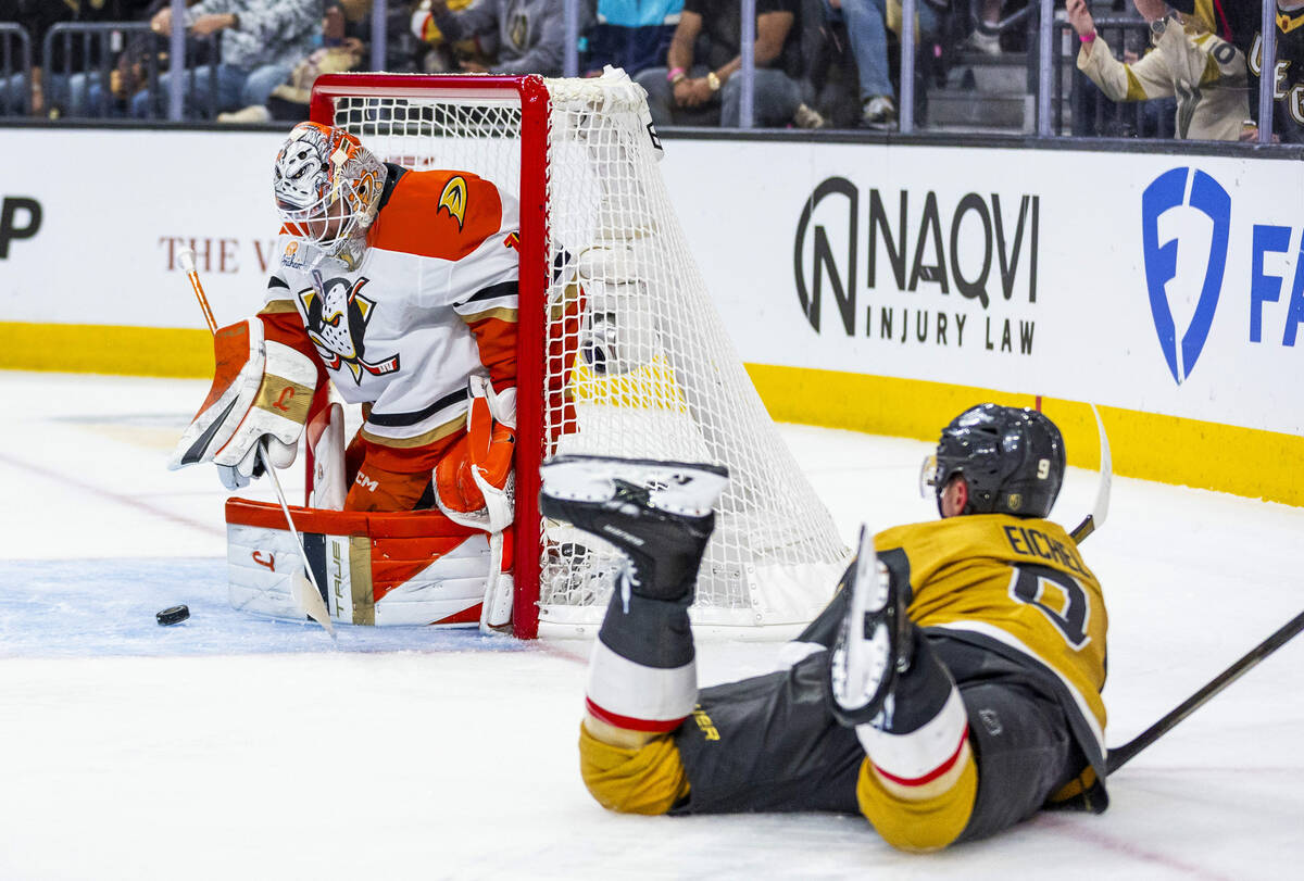 Golden Knights center Jack Eichel (9) is tripped onto the ice as Anaheim Ducks goaltender Lukas ...